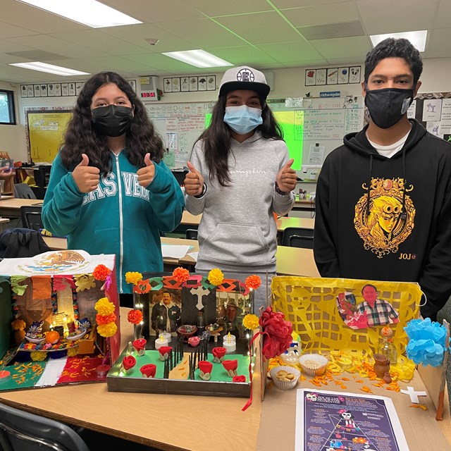 Students showing presenting their beautiful diorama de muertos!